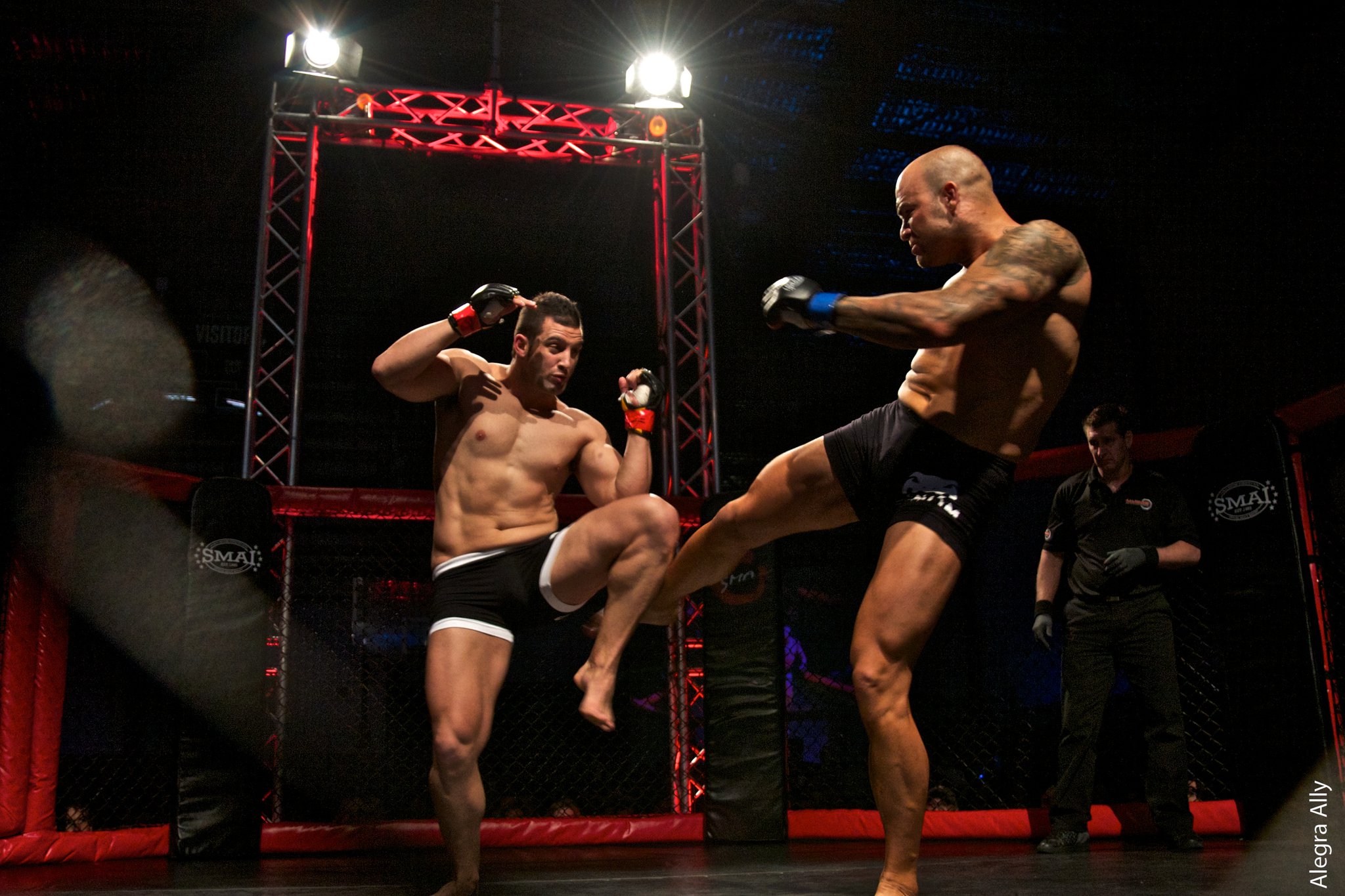 In the cage — grappling exchange, Full Circle fighter on top.